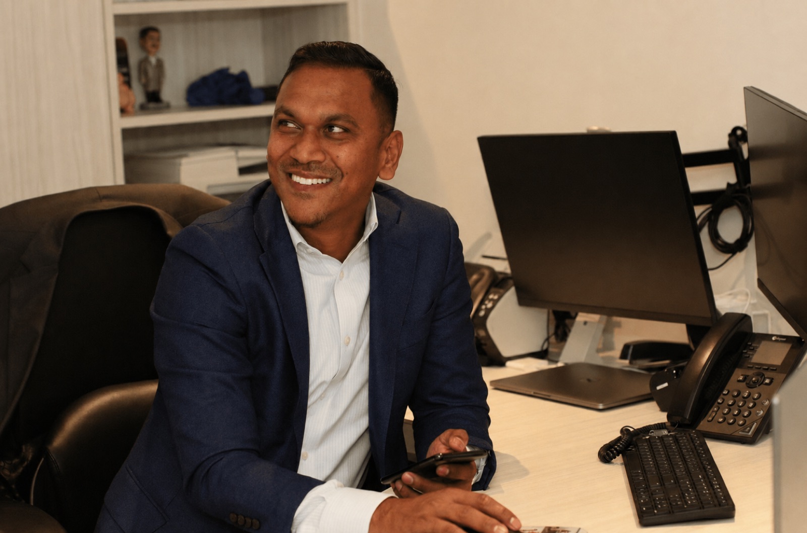 Raul Ramdayal, Founder & CEO of Powerlink, at his desk